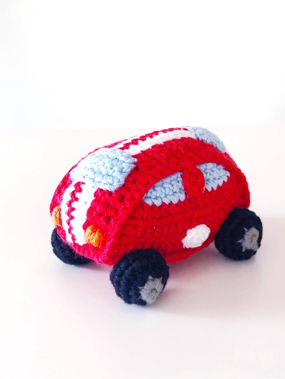 Bright Red Hand-Crocheted Toy Car with Light Blue Accents